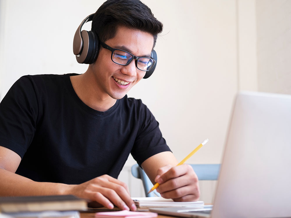 Man with headphones and computer